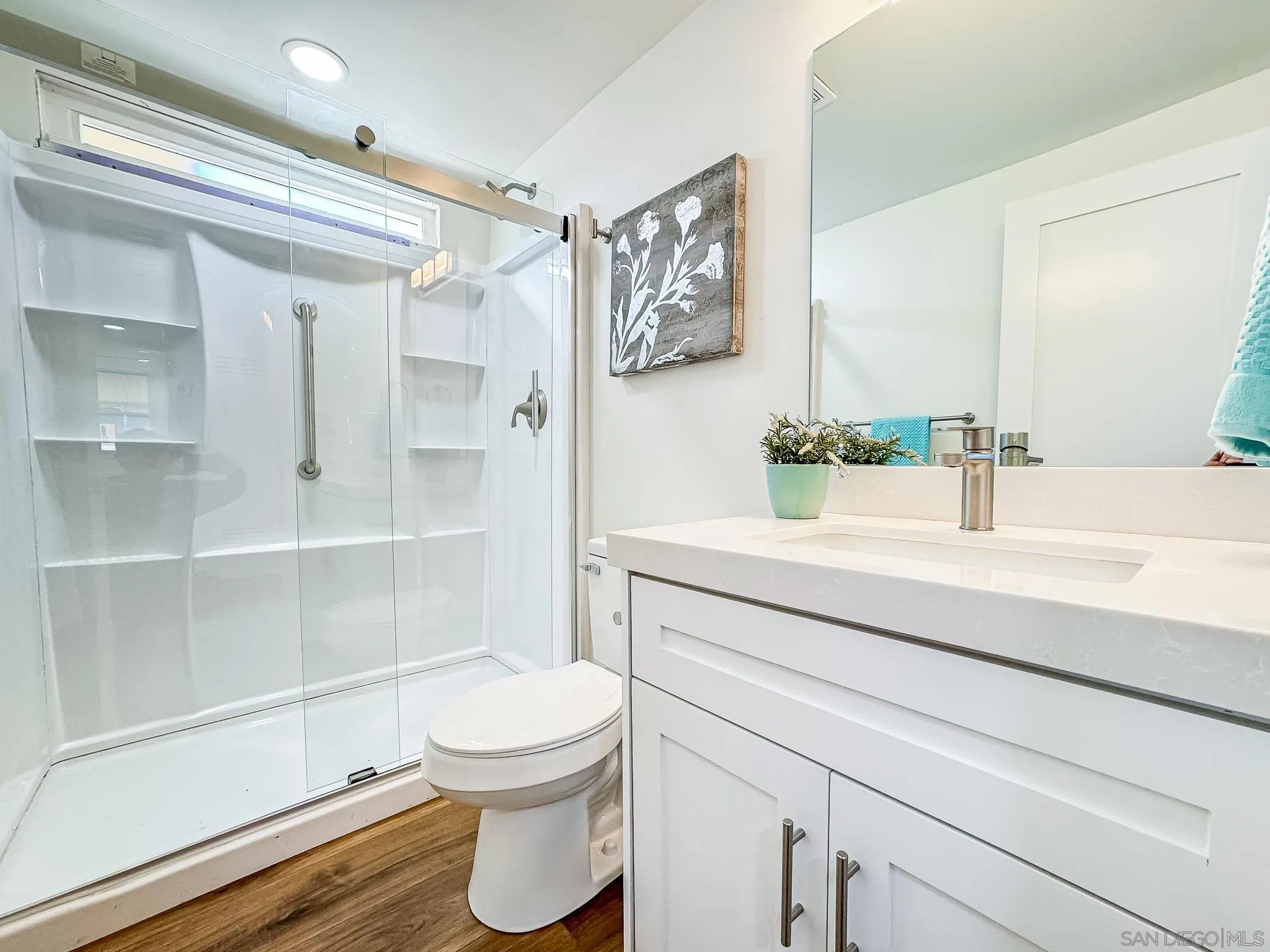 154 Falls View Lane Oceanside, CA 92056 - Photo 31 of 45 a bathroom with a sink a toilet and shower