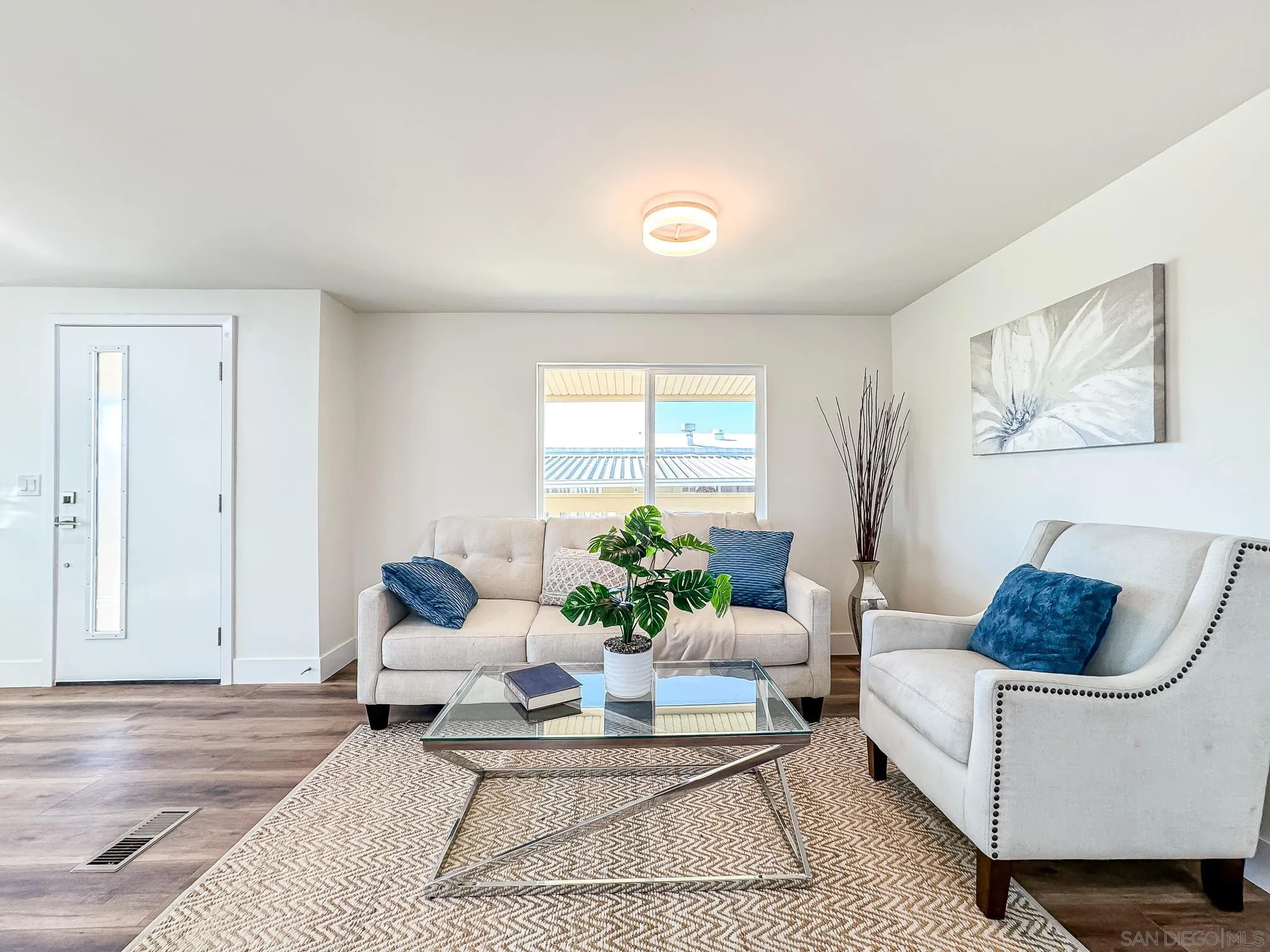 154 Falls View Lane Oceanside, CA 92056 - Photo 4 of 45 a living room with furniture and a potted plant