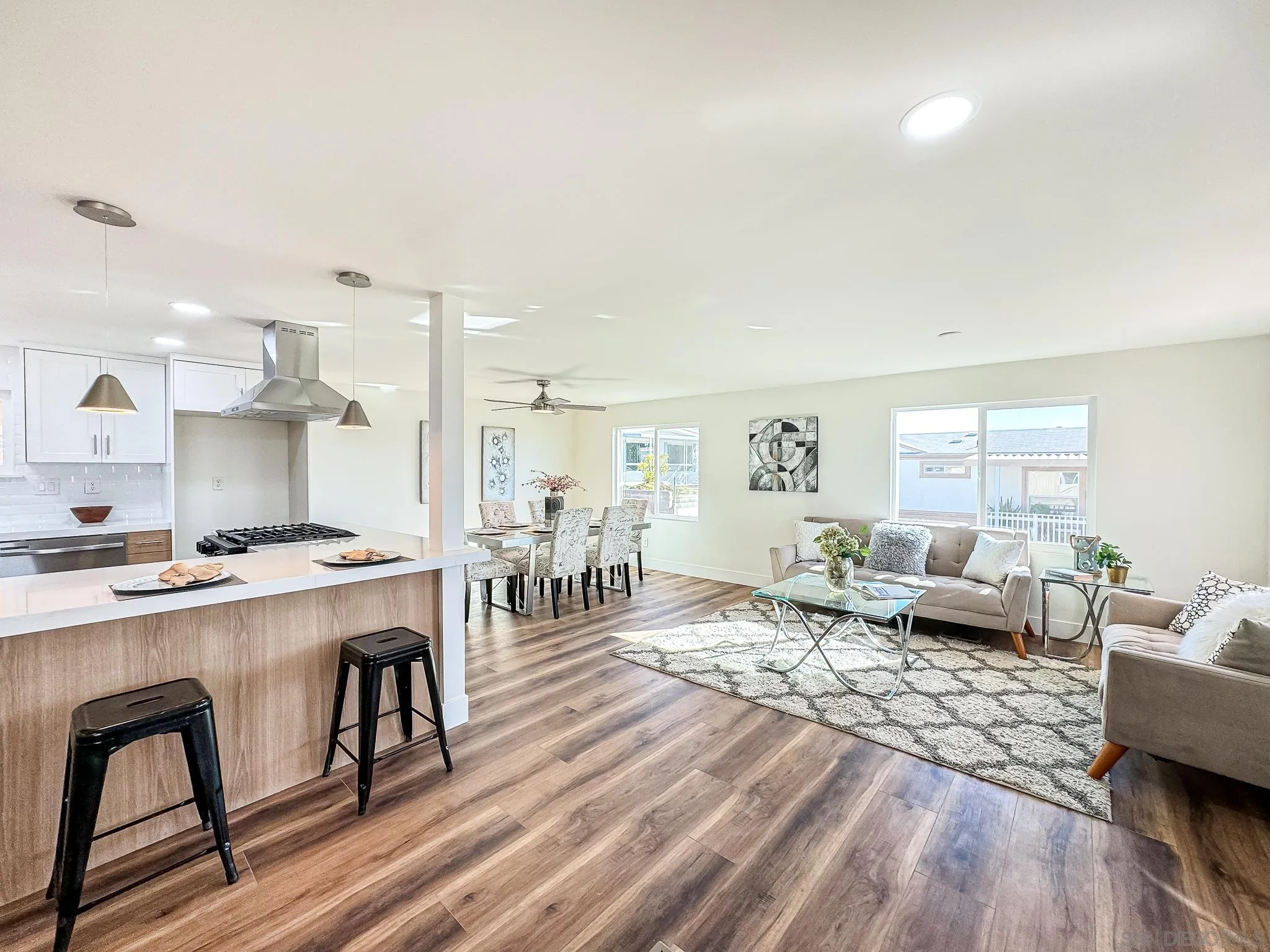 154 Falls View Lane Oceanside, CA 92056 - Photo 5 of 45 a living room with furniture a dining table and wooden floor