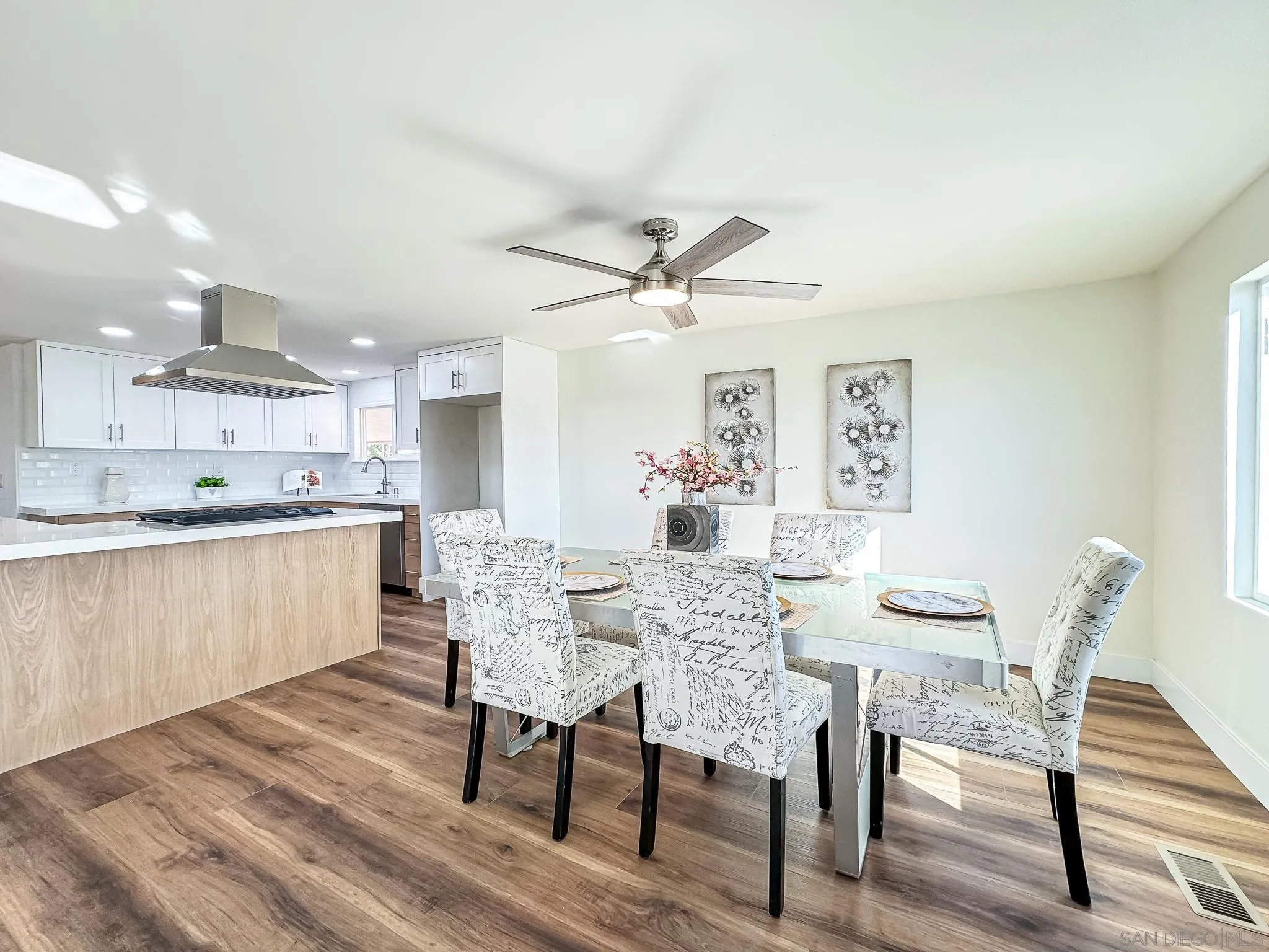 154 Falls View Lane Oceanside, CA 92056 - Photo 6 of 45 a view of a dining room with furniture and wooden floor