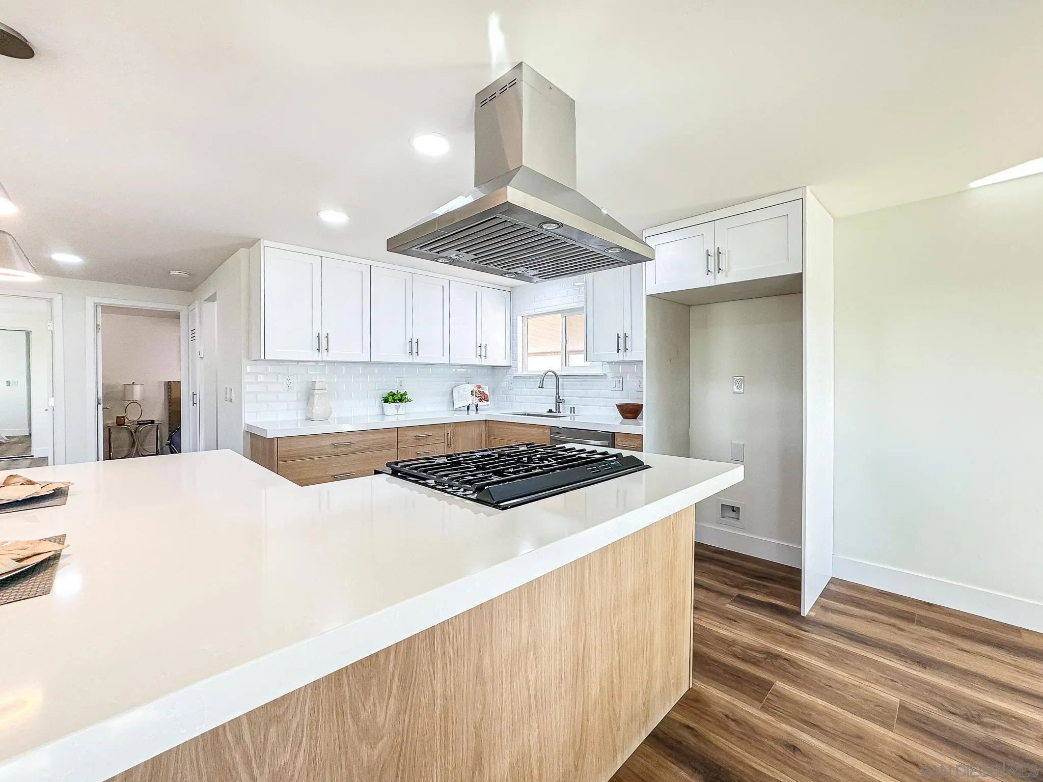154 Falls View Lane Oceanside, CA 92056 - Photo 8 of 45 a kitchen with a stove a sink a refrigerator and cabinets