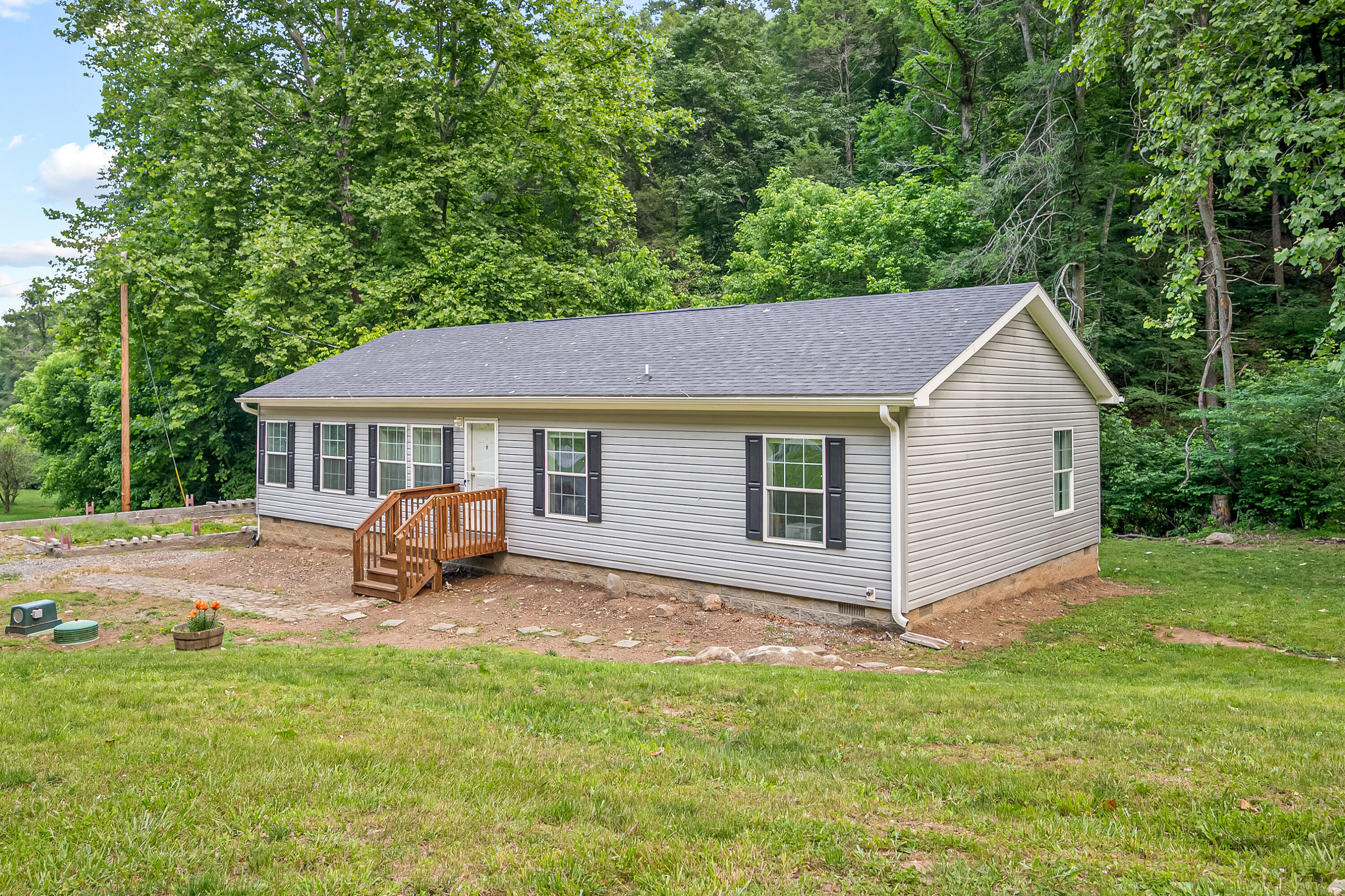 370 Ambrose Road Elliston, VA 24087 - Photo 1 of 63 a view of house with backyard and trees