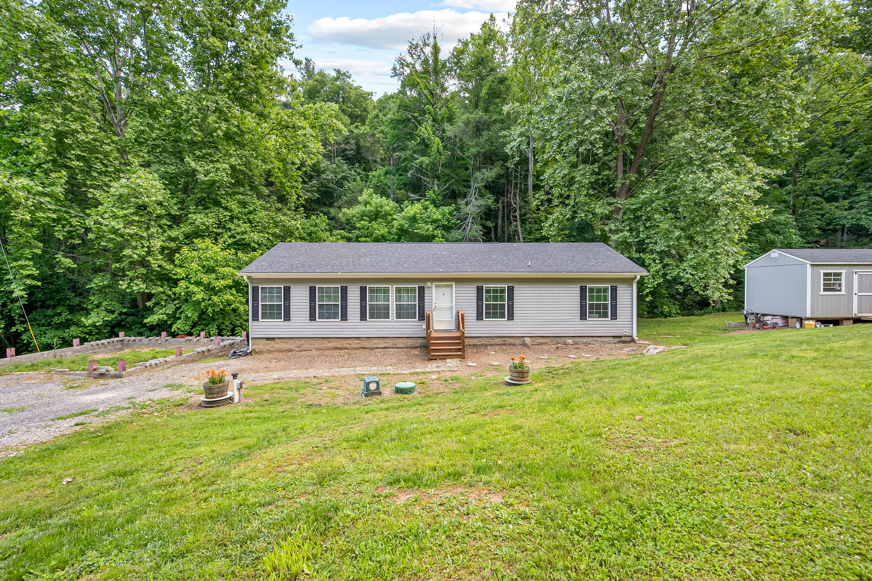 370 Ambrose Road Elliston, VA 24087 - Photo 3 of 63 a front view of a house with yard and green space