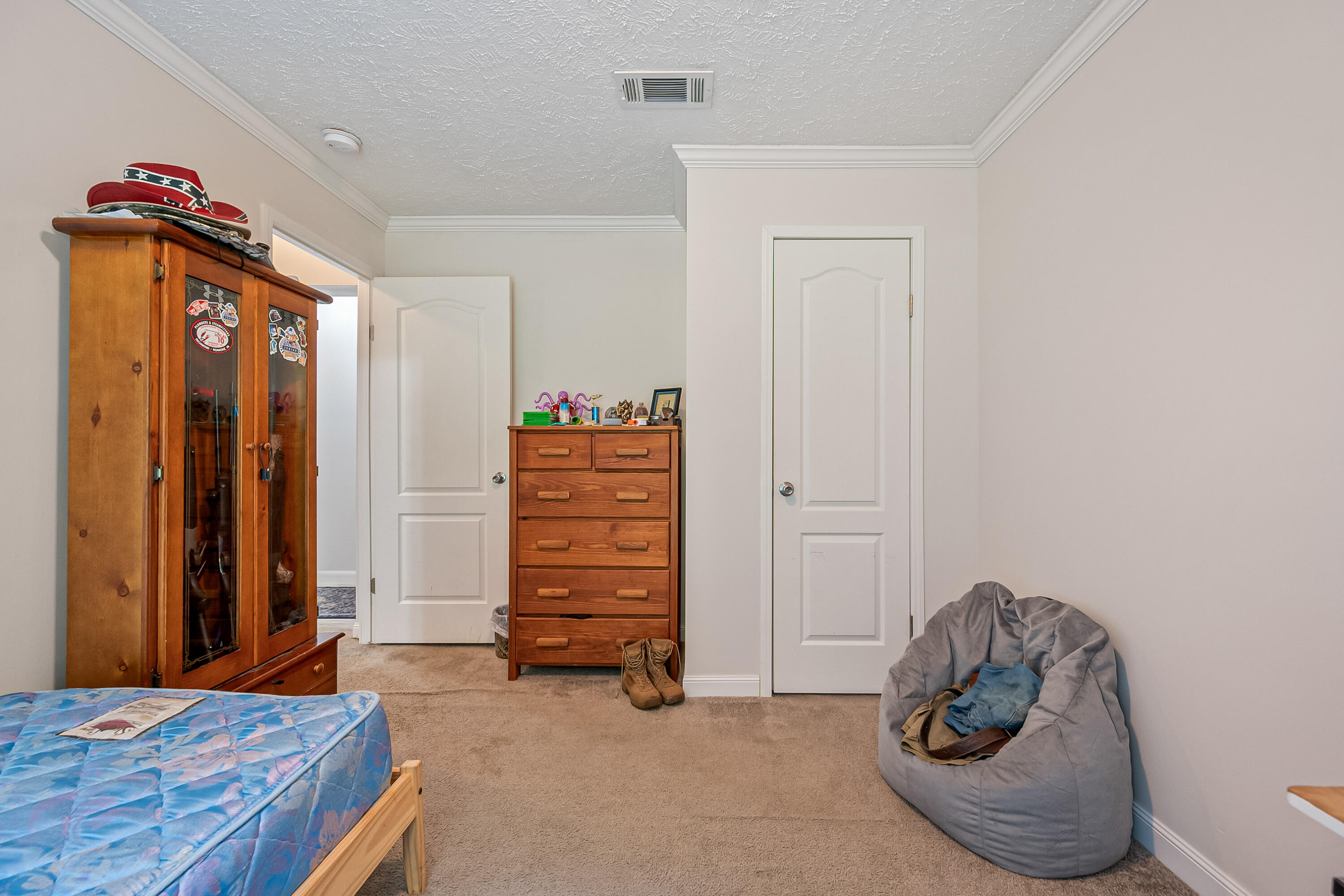 370 Ambrose Road Elliston, VA 24087 - Photo 34 of 63 a bedroom with a bed and a cabinet