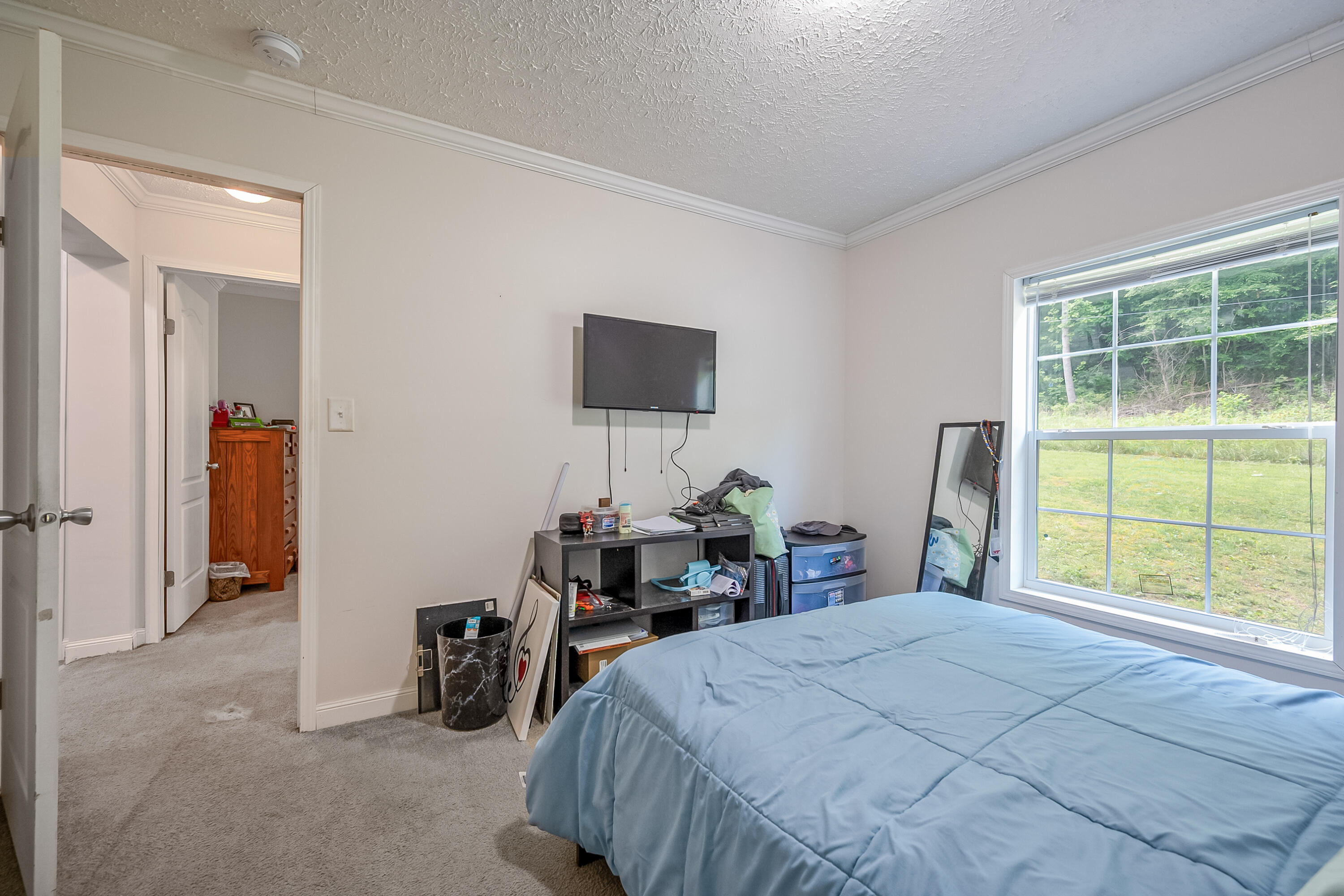 370 Ambrose Road Elliston, VA 24087 - Photo 37 of 63 a bed room with a bed and a chair