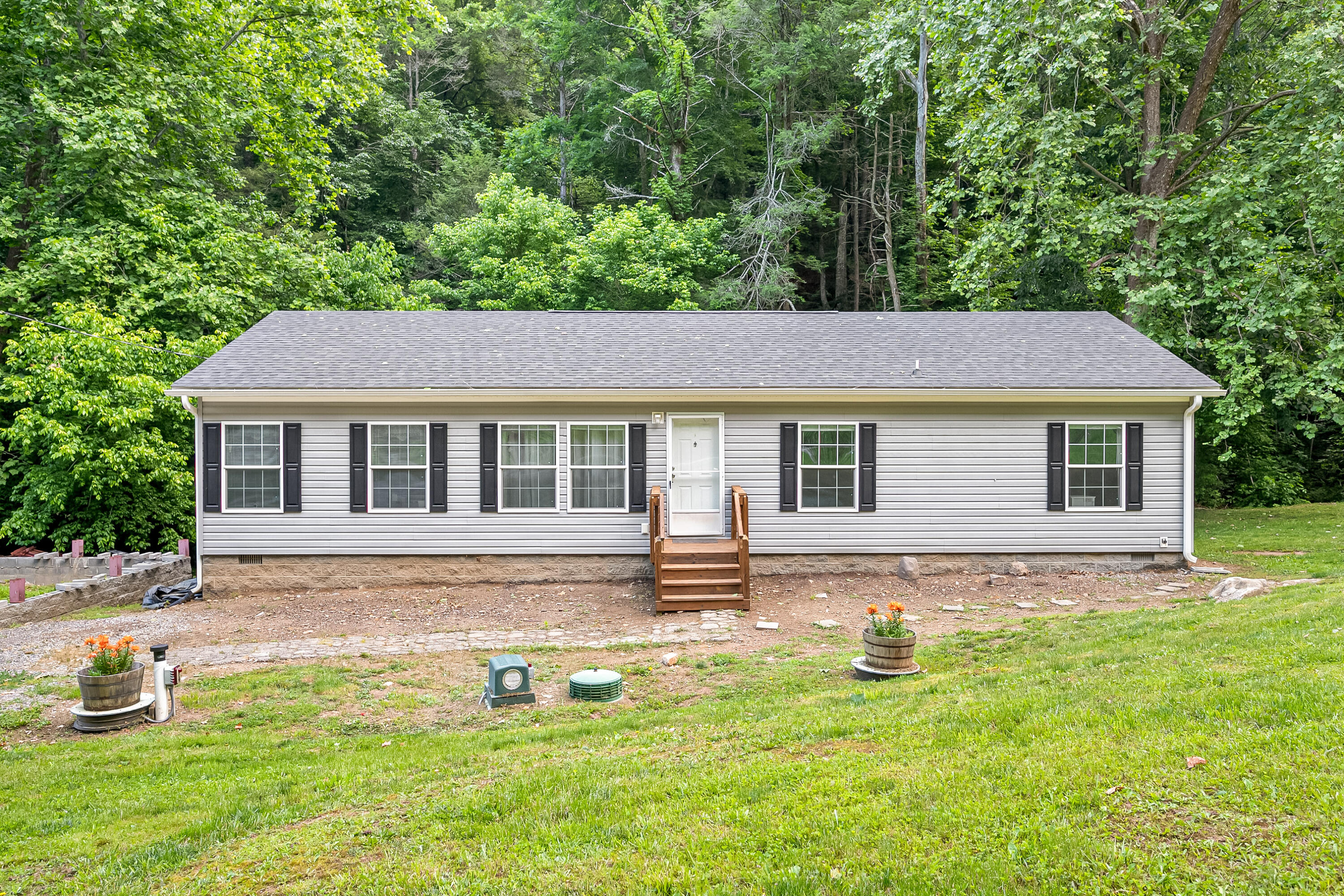 370 Ambrose Road Elliston, VA 24087 - Photo 4 of 63 a house that has tree in front of it
