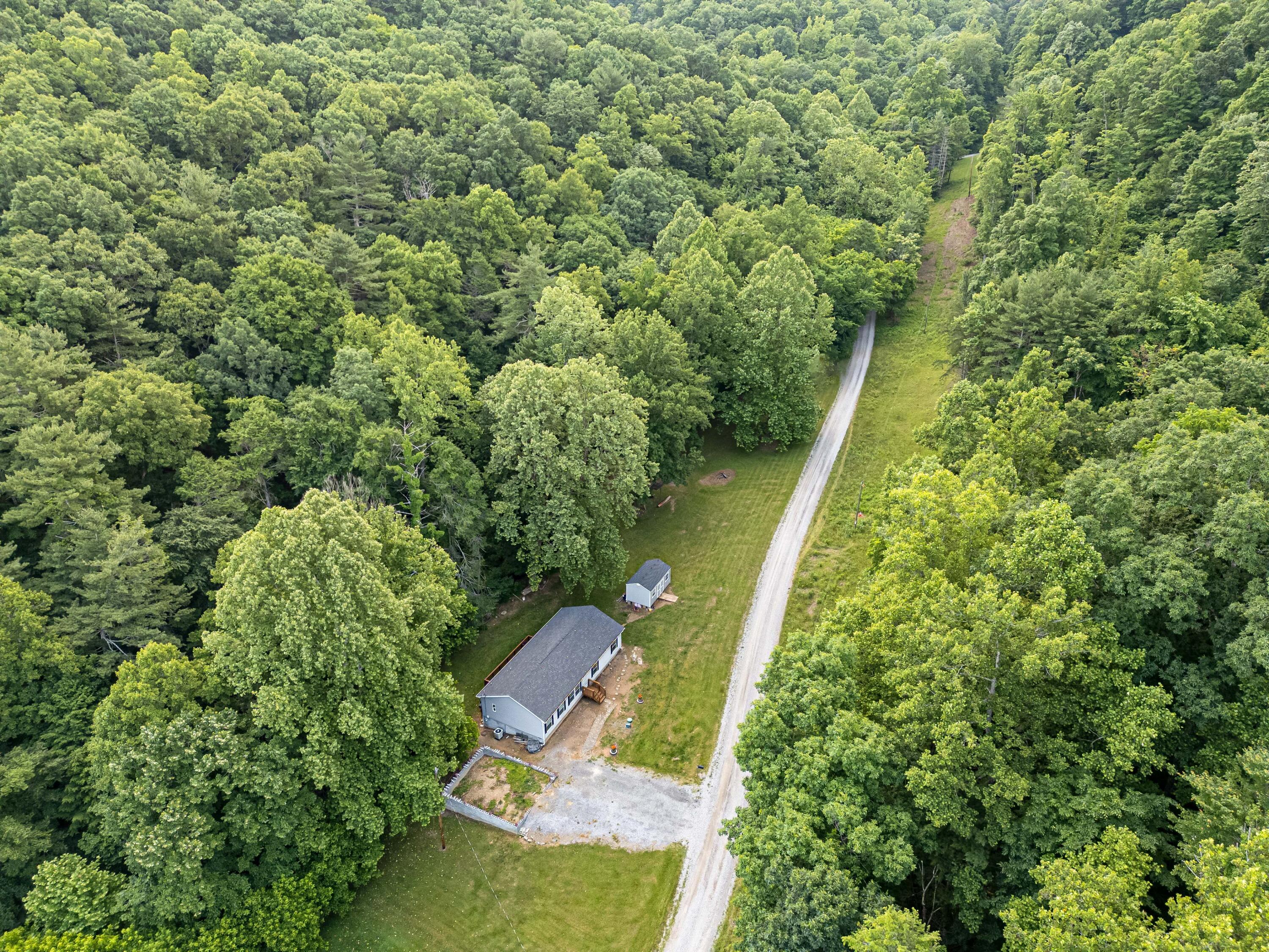 370 Ambrose Road Elliston, VA 24087 - Photo 58 of 63 an aerial view of residential house with outdoor space and trees all around