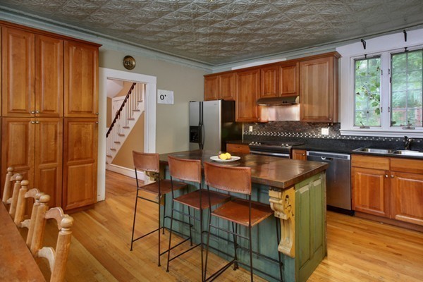 88 Lambert Avenue Boston, MA 02119 - Photo 11 of 19 a kitchen with stainless steel appliances granite countertop a stove a sink dishwasher and a refrigerator