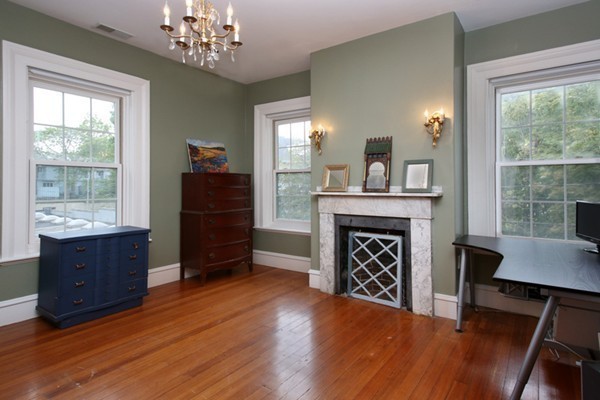 88 Lambert Avenue Boston, MA 02119 - Photo 12 of 19 a living room with furniture and a fireplace