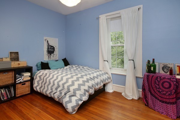 88 Lambert Avenue Boston, MA 02119 - Photo 15 of 19 a bedroom with a bed table and a window