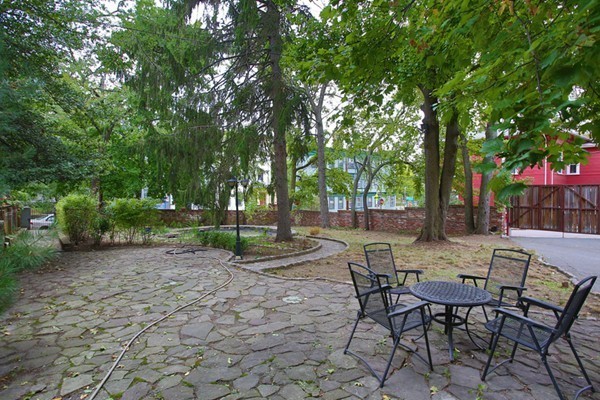88 Lambert Avenue Boston, MA 02119 - Photo 3 of 19 a view of a chairs and tables in the patio