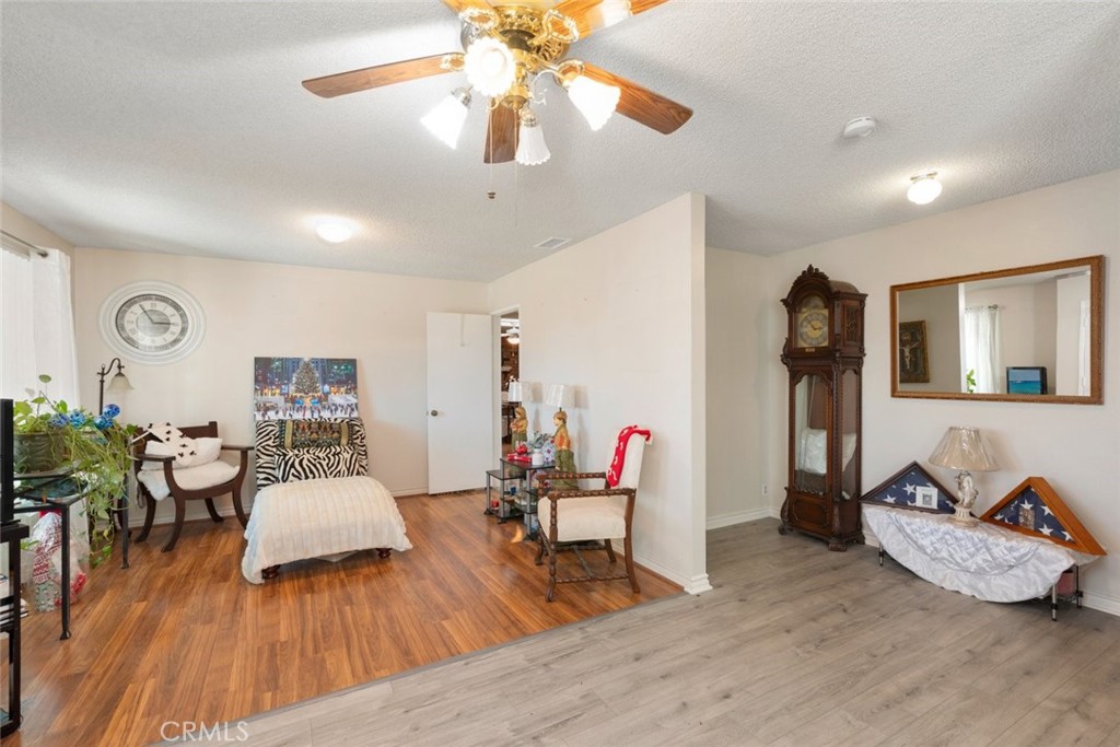27262 Embassy Street Menifee, CA 92586 - Photo 13 of 35 a living room with furniture and wooden floor