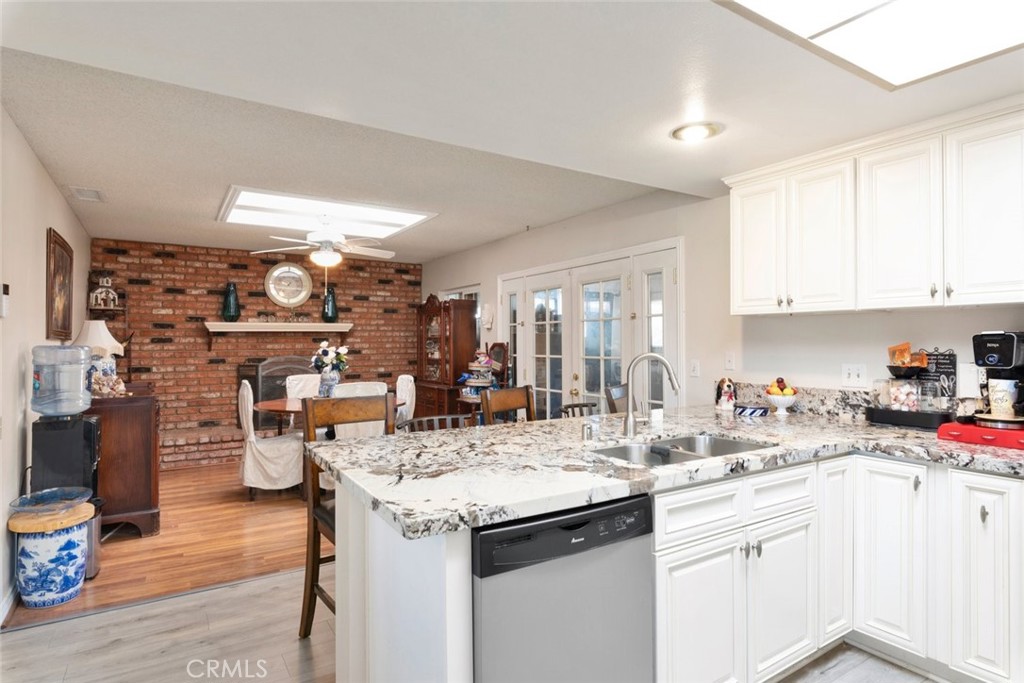 27262 Embassy Street Menifee, CA 92586 - Photo 14 of 35 a kitchen with a sink and cabinets