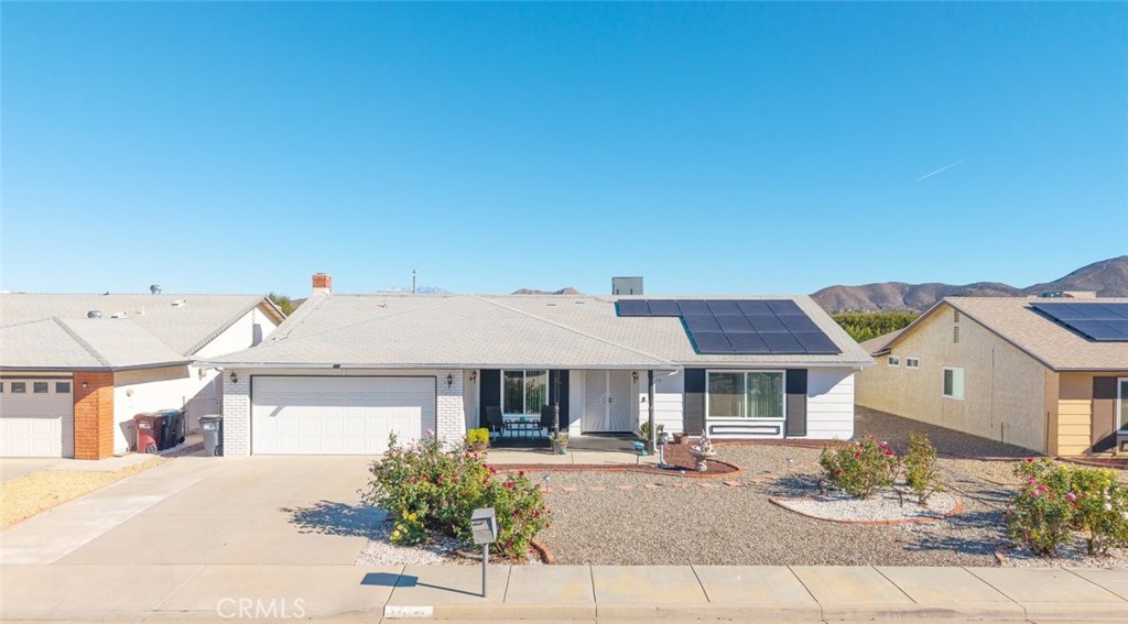 27262 Embassy Street Menifee, CA 92586 - Photo 2 of 35 front view of a house with table and chairs