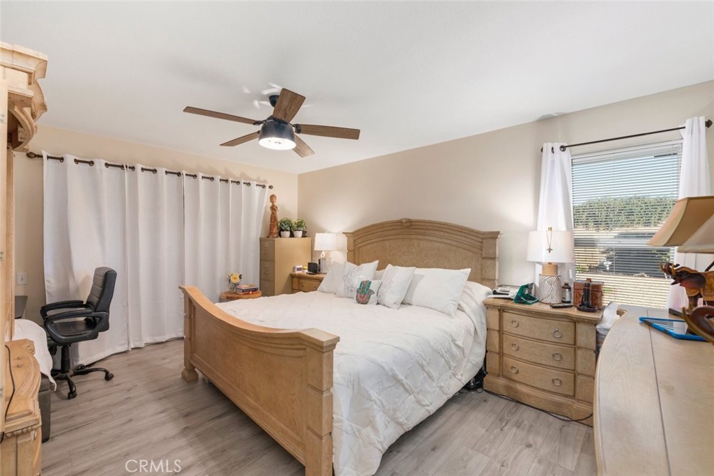 27262 Embassy Street Menifee, CA 92586 - Photo 23 of 35 a bedroom with bed and window