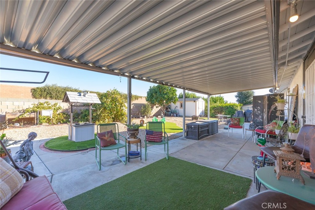 27262 Embassy Street Menifee, CA 92586 - Photo 26 of 35 a view of a patio with chairs and a patio