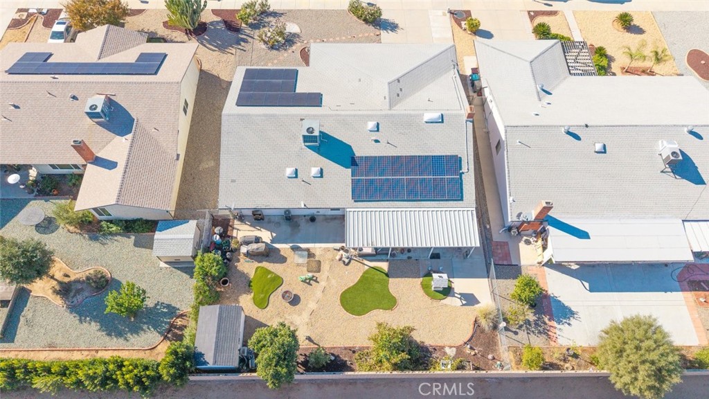 27262 Embassy Street Menifee, CA 92586 - Photo 30 of 35 an aerial view of a house with a yard and large trees