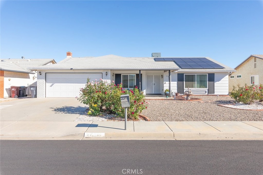 27262 Embassy Street Menifee, CA 92586 - Photo 3 of 35 a front view of a house with a yard