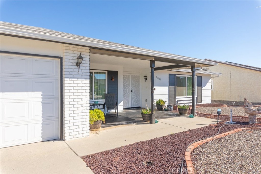 27262 Embassy Street Menifee, CA 92586 - Photo 6 of 35 a view of a lounge chairs in the porch