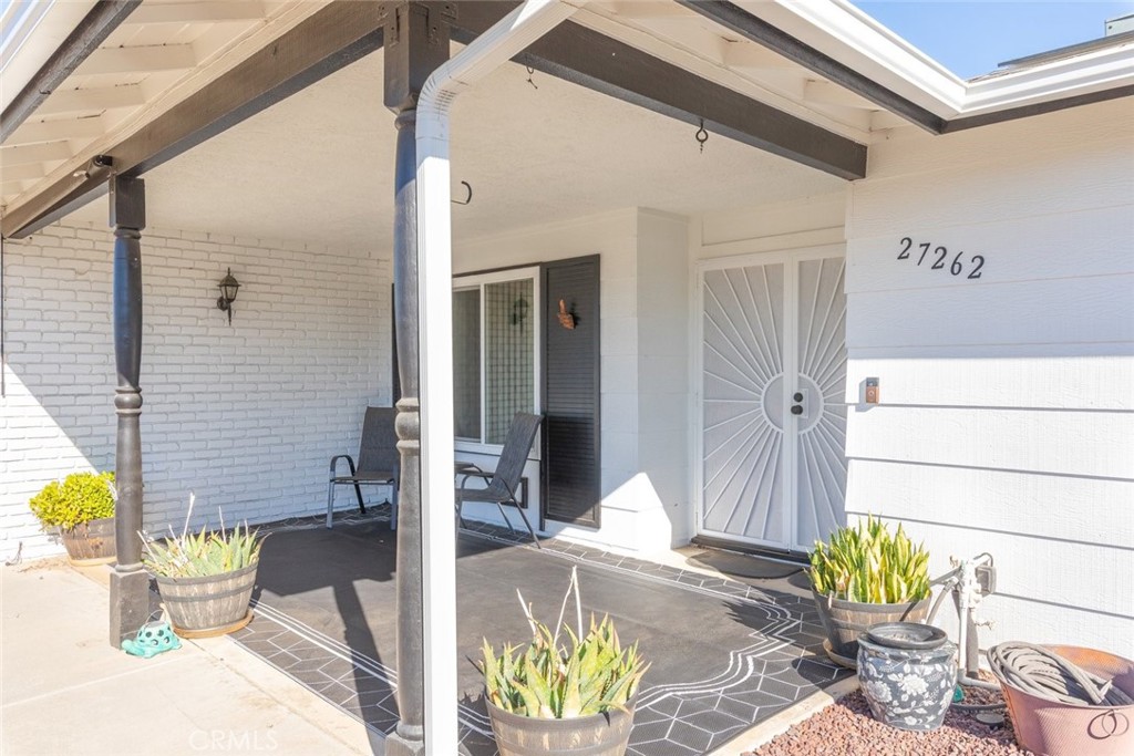 27262 Embassy Street Menifee, CA 92586 - Photo 7 of 35 a front view of a house with outdoor seating