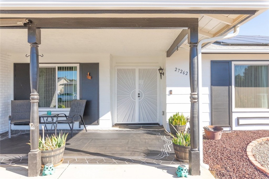 27262 Embassy Street Menifee, CA 92586 - Photo 9 of 35 a front view of a house with outdoor seating