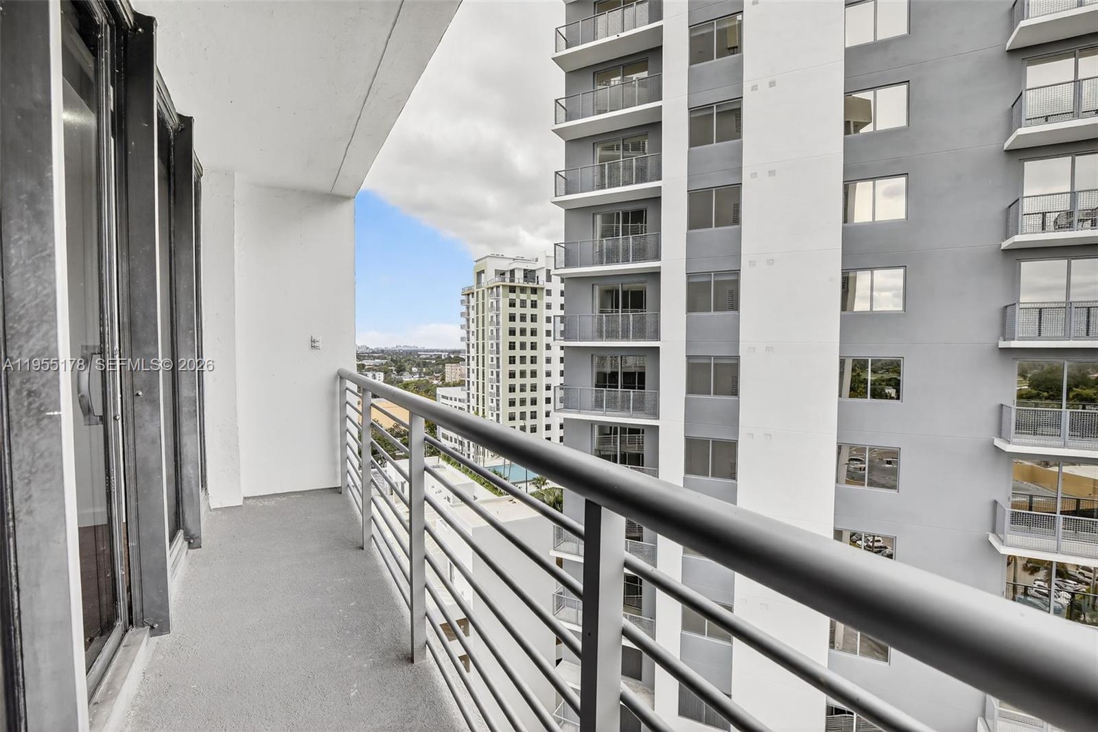1720 Harrison Street, Unit 14H Hollywood, FL 33020 - Photo 23 of 37 a view of balcony with a bookshelf