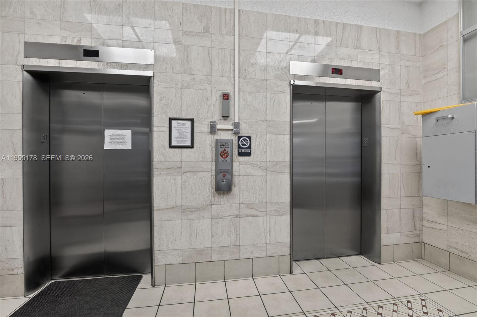 1720 Harrison Street, Unit 14H Hollywood, FL 33020 - Photo 30 of 37 a bathroom with a shower and mirror