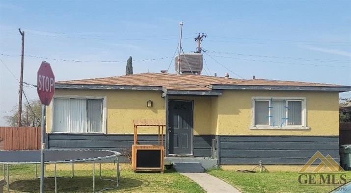 a view of a house with a porch and furniture