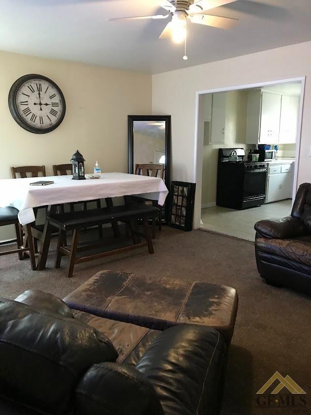 Undisclosed Address Bakersfield, CA 93305 - Photo 3 of 8 a living room with furniture and a wooden floor