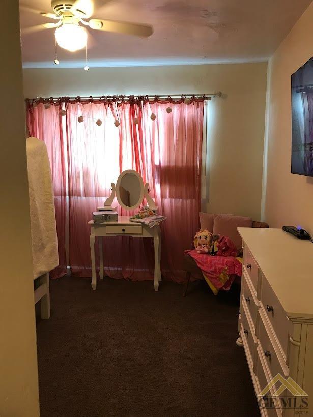 Undisclosed Address Bakersfield, CA 93305 - Photo 6 of 8 a bedroom with furniture and a window