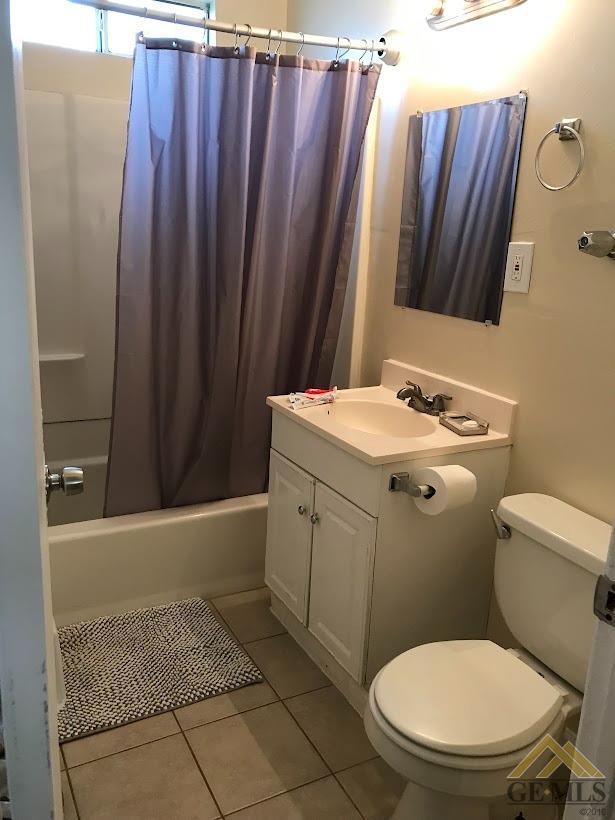 Undisclosed Address Bakersfield, CA 93305 - Photo 7 of 8 a bathroom with a granite countertop toilet and sink