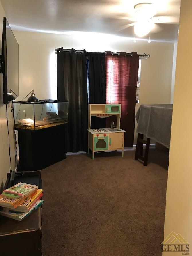 Undisclosed Address Bakersfield, CA 93305 - Photo 8 of 8 a room with furniture and lamp