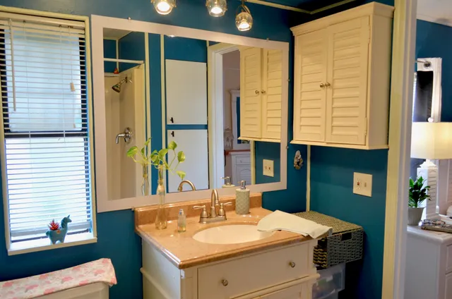 a front view of multiple houses with yard