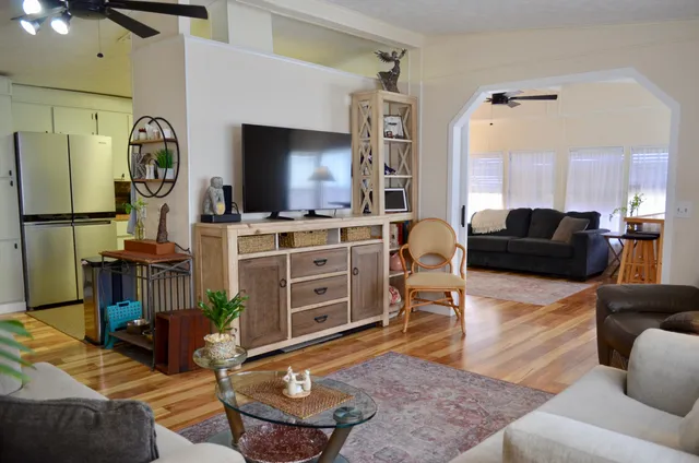 a living room with furniture and a flat screen tv