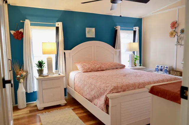 a bathroom with a sink and mirror with toilet