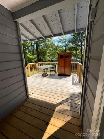 a view of outdoor space with deck and wooden floor