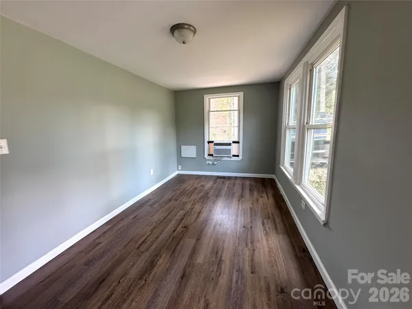 a kitchen with refrigerator and window