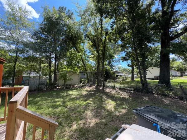 a view of balcony with wooden floor and outdoor seating