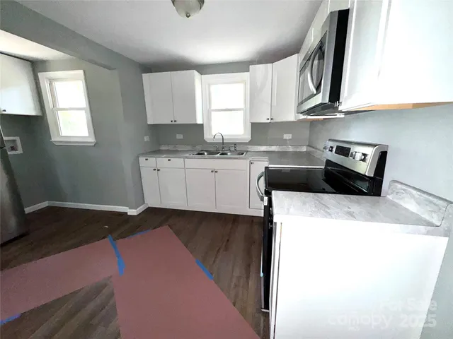 a kitchen with a sink and cabinets