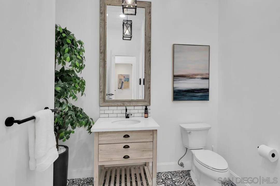 17101 Circa Oriente Rancho Santa Fe, CA 92067 - Photo 16 of 35 a bathroom with a sink toilet and mirror