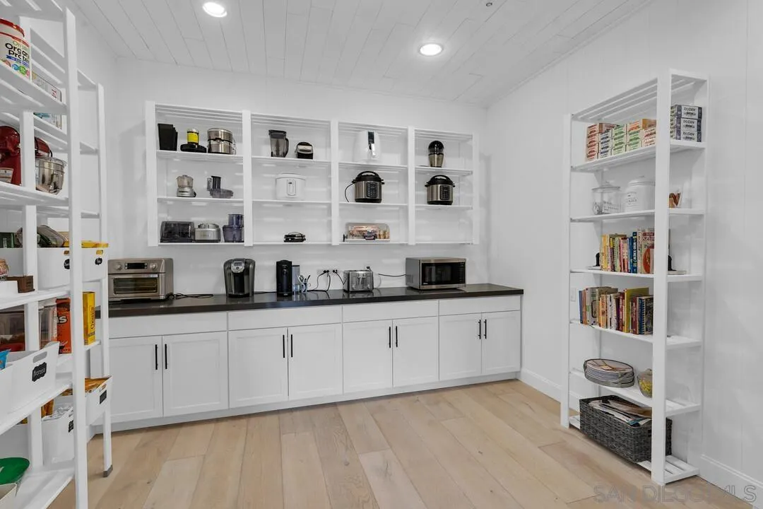 17101 Circa Oriente Rancho Santa Fe, CA 92067 - Photo 5 of 35 a kitchen with stainless steel appliances granite countertop a sink and cabinets