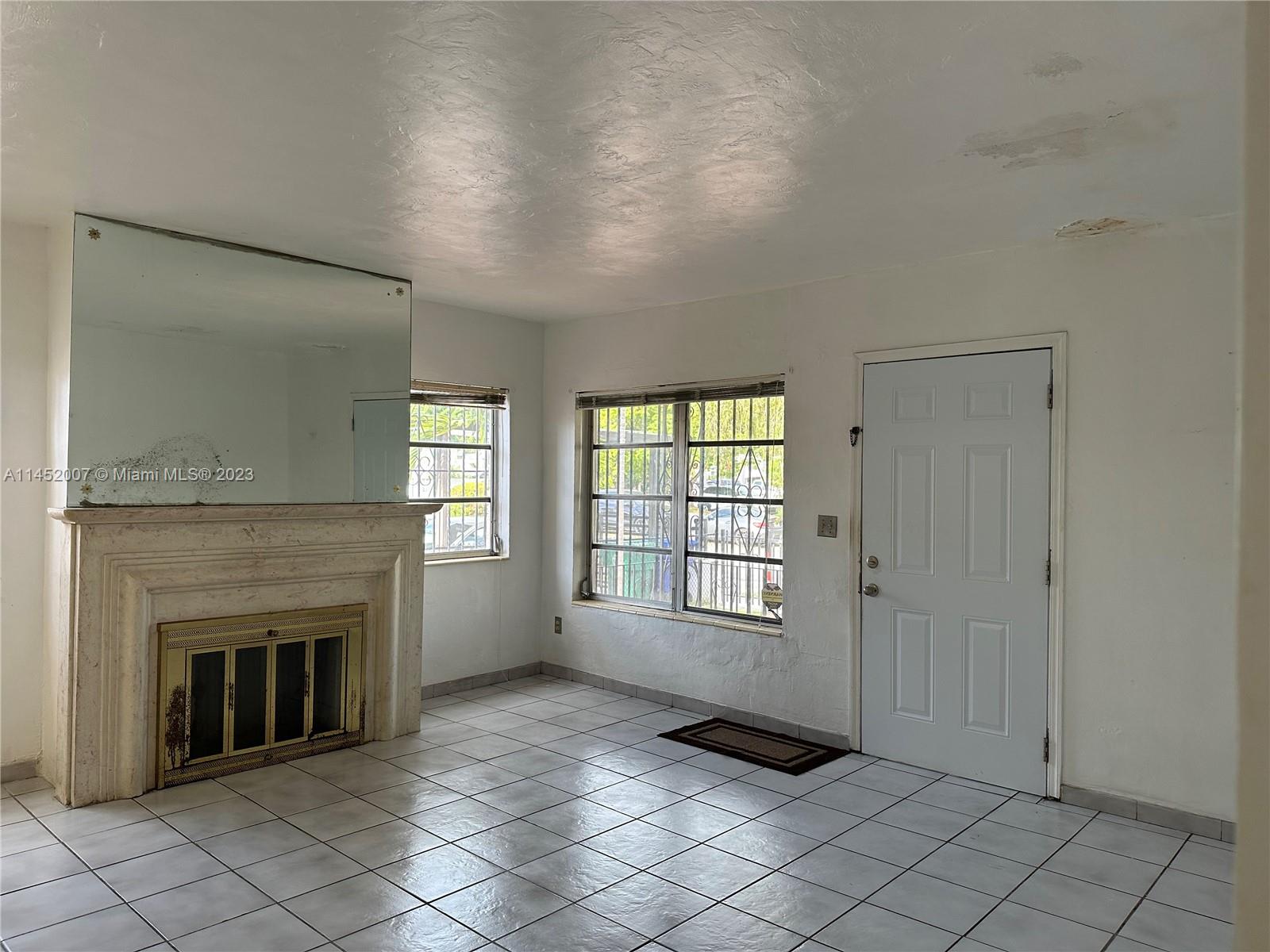West Flagler Miami, FL 33135 - Photo 14 of 46 a view of an empty room with window and fire place