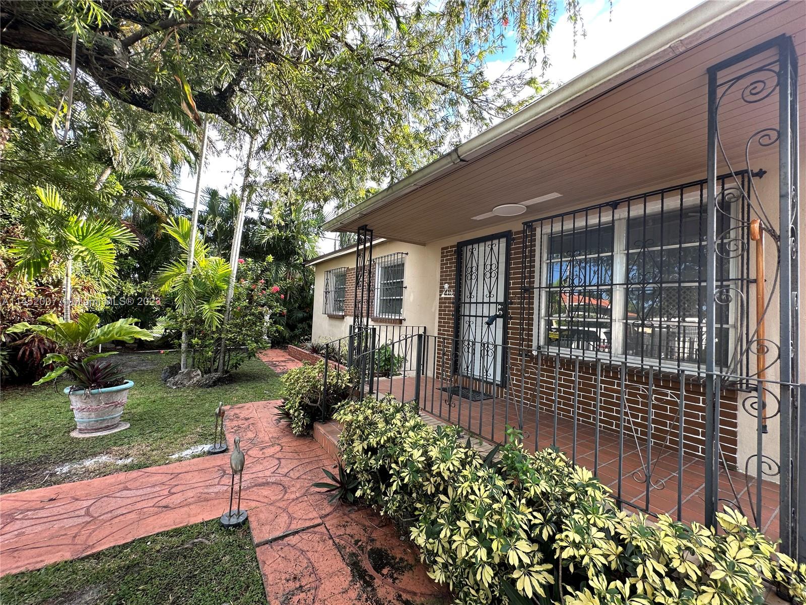 West Flagler Miami, FL 33135 - Photo 2 of 46 a front view of a house with garden