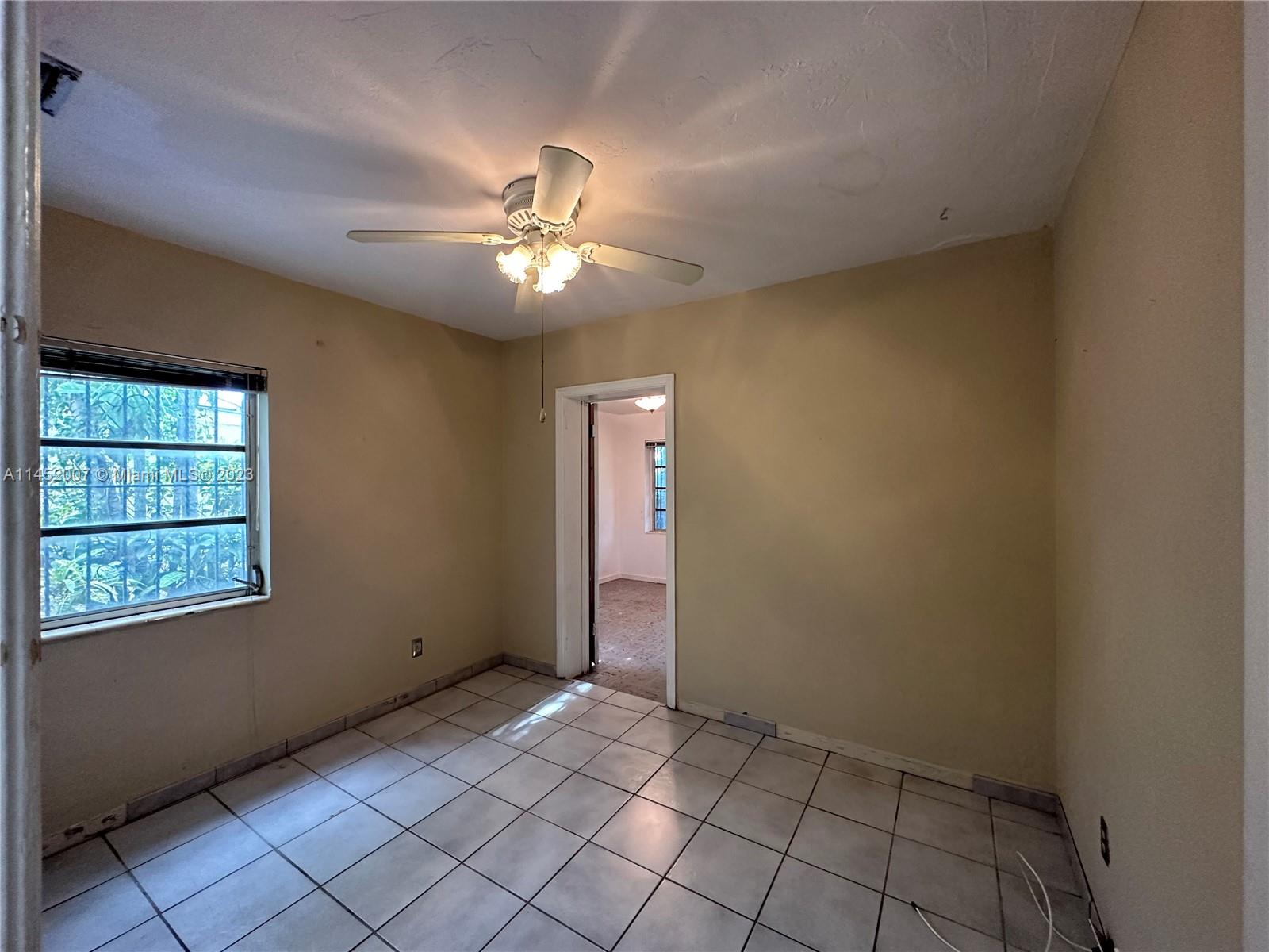 West Flagler Miami, FL 33135 - Photo 37 of 46 an empty room with windows and fan