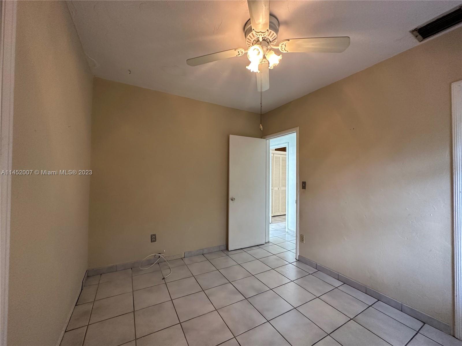 West Flagler Miami, FL 33135 - Photo 39 of 46 an empty room with chandelier fan