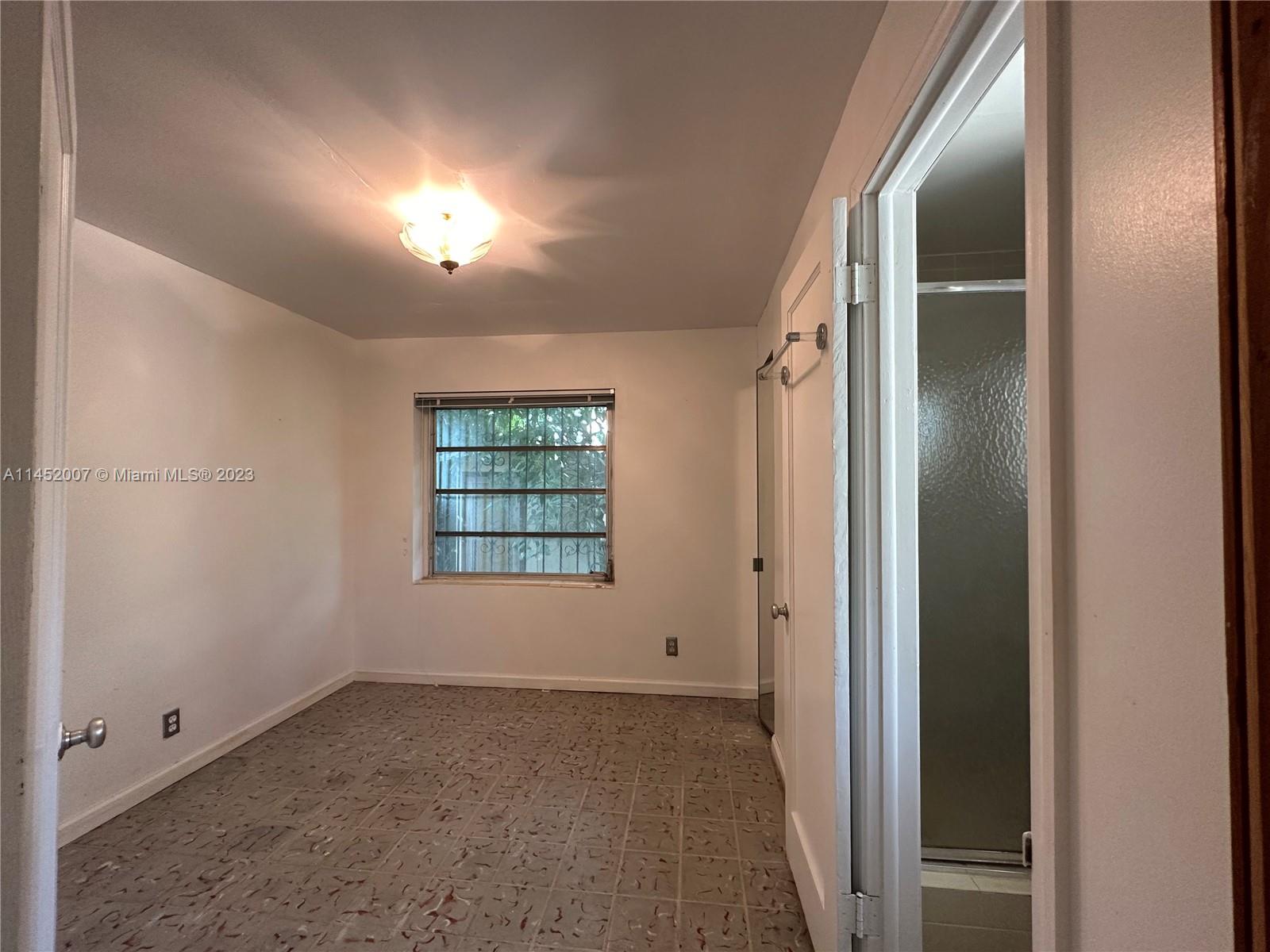 West Flagler Miami, FL 33135 - Photo 41 of 46 an empty room with windows and closet