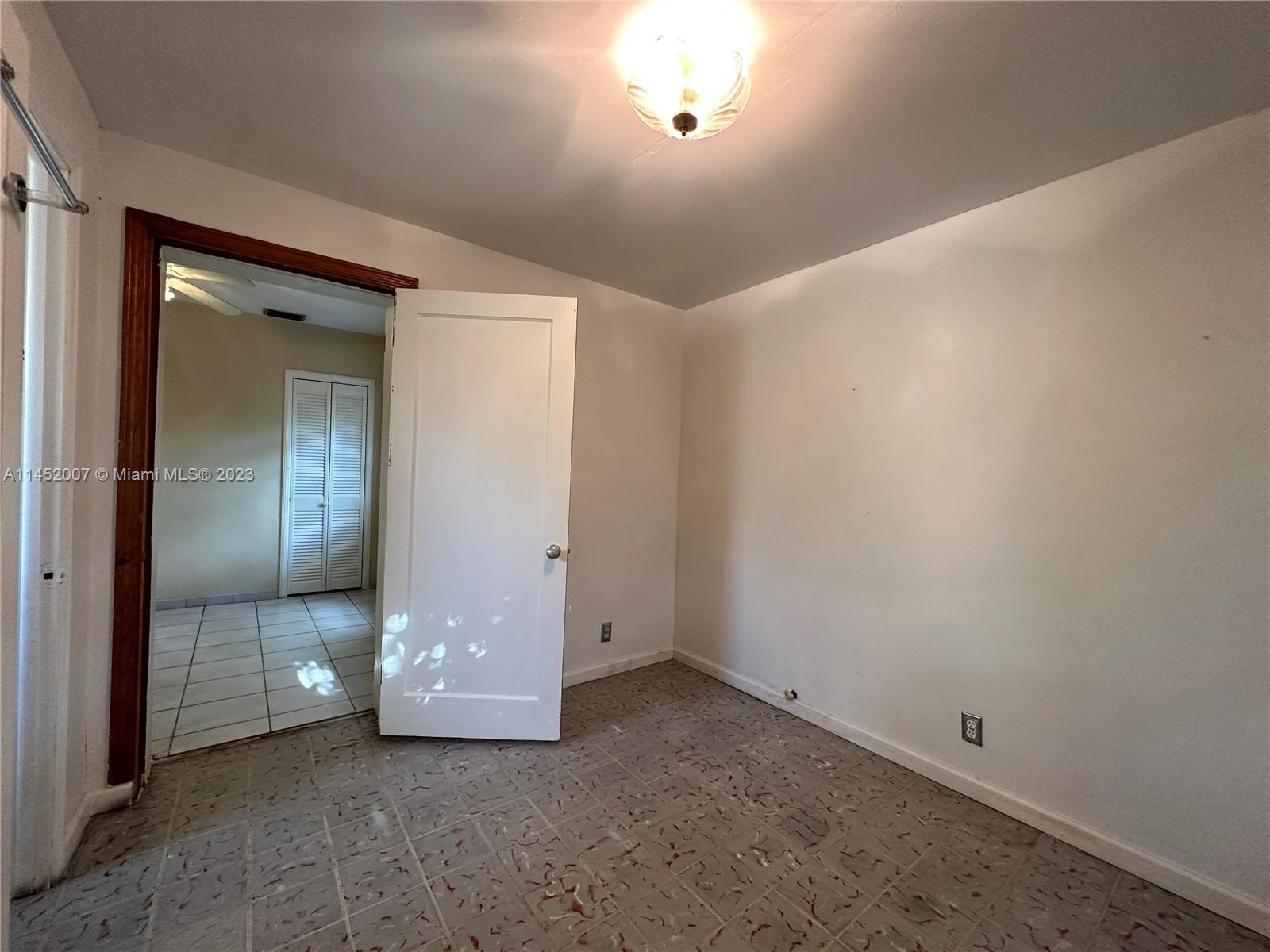 West Flagler Miami, FL 33135 - Photo 42 of 46 an empty room with a mirror