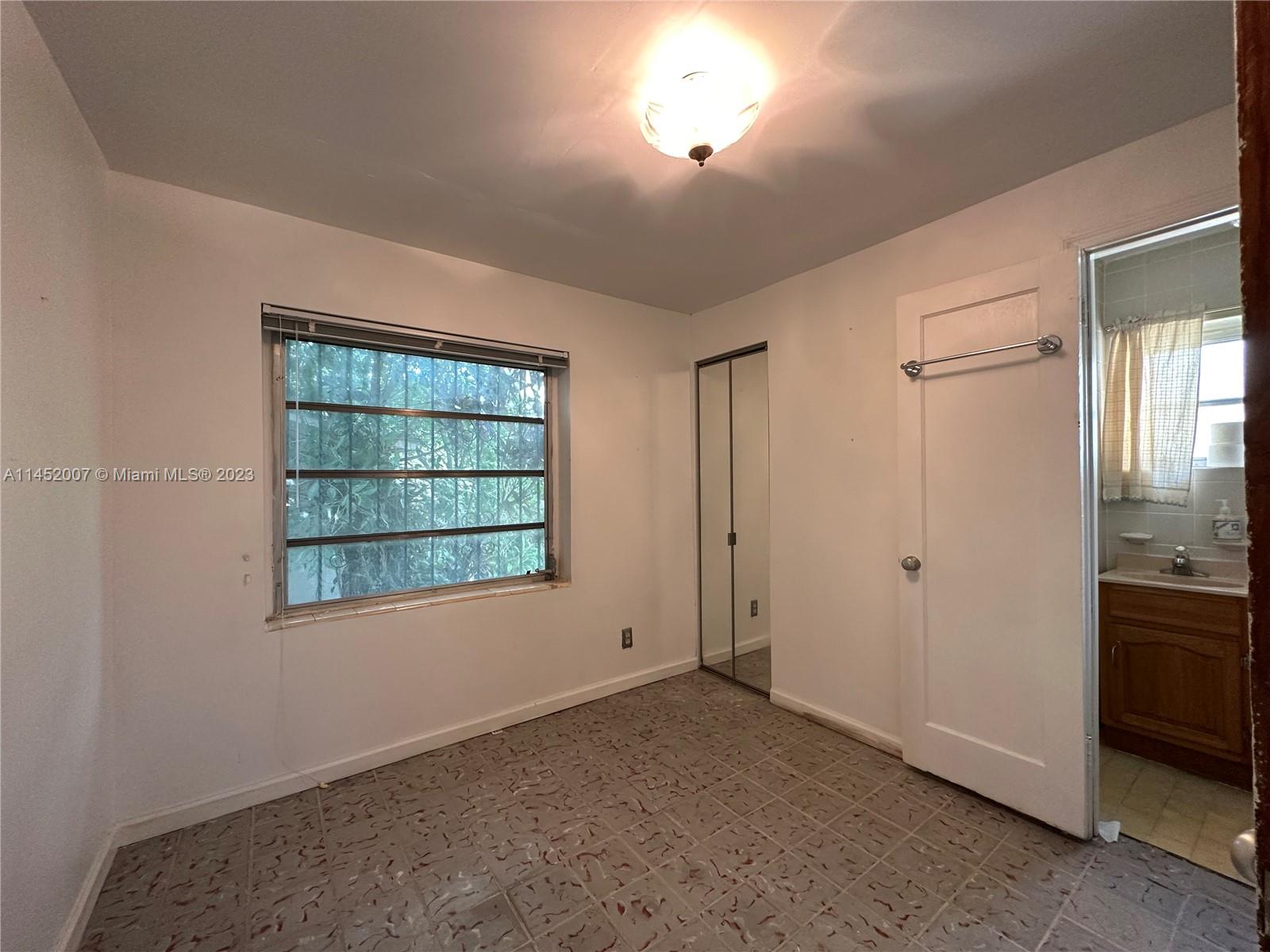 West Flagler Miami, FL 33135 - Photo 44 of 46 an empty room with windows and closet