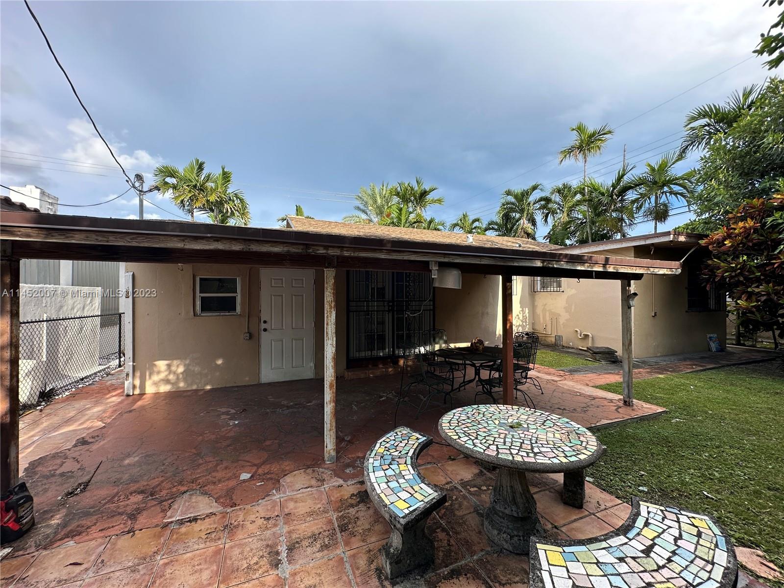 West Flagler Miami, FL 33135 - Photo 5 of 46 a view of a chair and table in backyard of the house