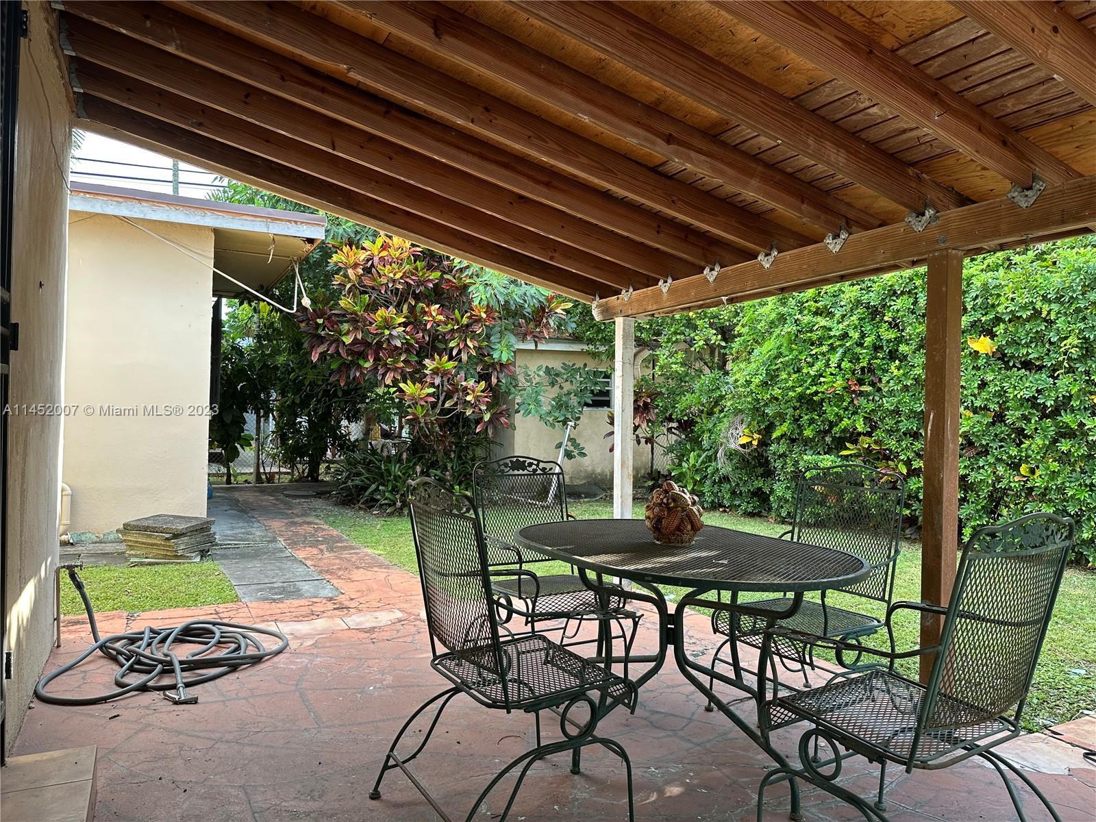 West Flagler Miami, FL 33135 - Photo 8 of 46 a patio with yard table and chairs